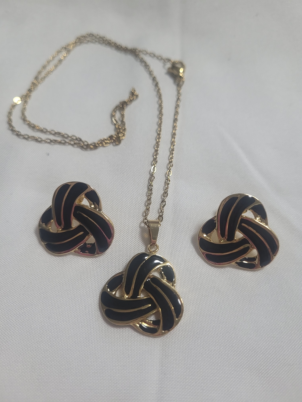 Gold-Tone Black Enamel Knot Pendant Necklace and Earring Set